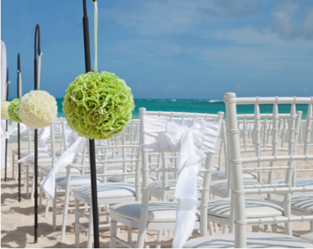 chairs set up for beach wedding and rose aisle