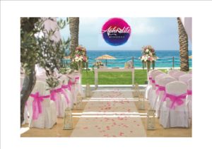 Beach wedding ceremony set up and Aphrodite Weddings logo