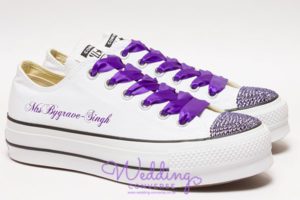 White platform trainers with bright purple silk laces, purple crystals on the toes and Mrs on the side