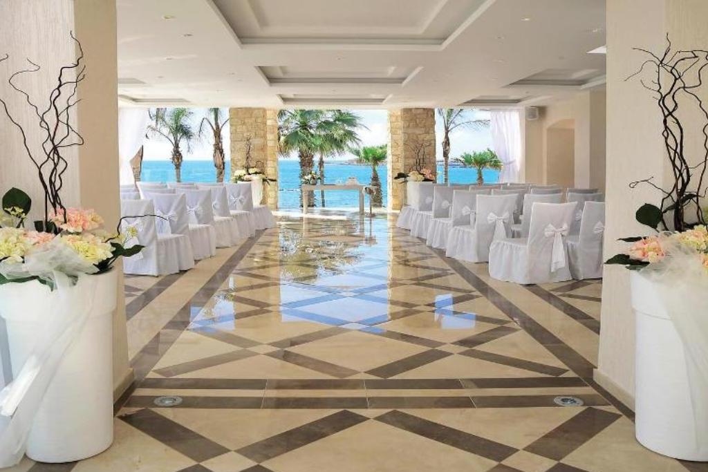 Wedding ceremony set up semi indoor and outdoor overlooking the sea