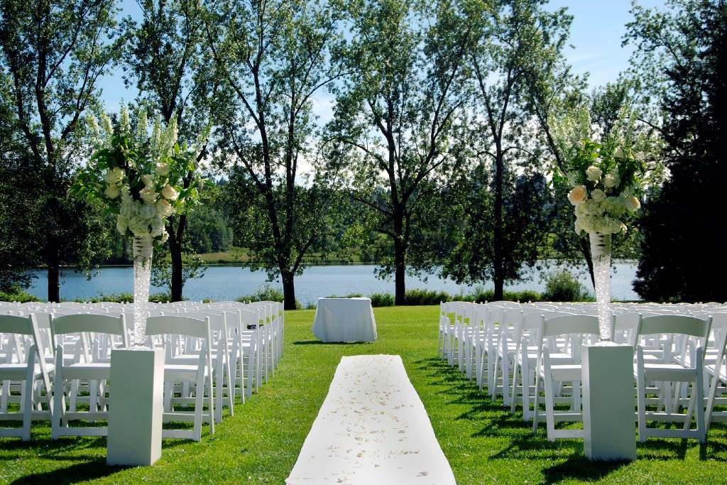 Wedding ceremony set overlooking lake